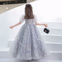 Little girl’s gray prom dress