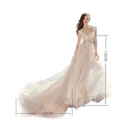 Embroidered champagne tailed wedding dress strapless backless