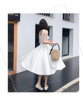 Sleeveless calf Length white dress