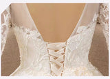 Long sleeve white embroidered wedding dress