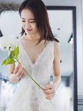 V neck white tailed wedding dress