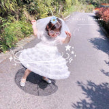 Little girl’s sequin white dress