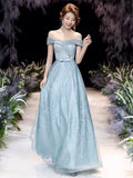 Off the shoulder sparkly blue green prom dress
