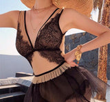 Black lace swimwear with cover skirt.