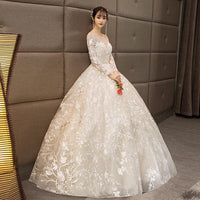 Long sleeve white embroidered wedding dress