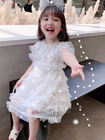 Little girl’s sequin white dress