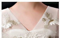 White embroidered trailing quinceanera dress