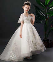 White embroidered trailing quinceanera dress