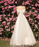 Off the shoulder wedding gown with pearls