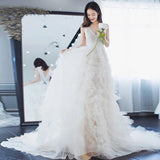V neck white tailed wedding dress