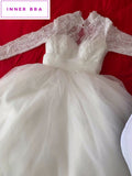 Long sleeve lace and tulle white wedding dress