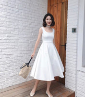 Sleeveless calf Length white dress