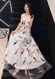 Sleeveless embroidered bird tailed prom dress
