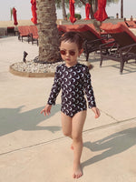 Long sleeve swimsuit for baby girl black white