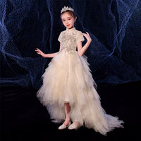 Little girl’s champagne ball gown with train
