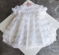 Little girl’s sequin white dress