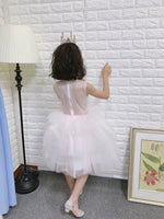 Little girl's sleeveless white ball gown