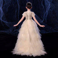 Little girl’s champagne ball gown with train