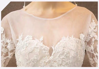 Long sleeve white embroidered wedding dress