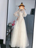 Long sleeve tulle champagne wedding gown