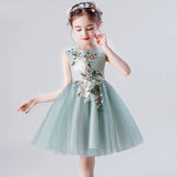 Embroidered little girl's short green dress