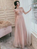 Light pink tulle prom dress with tiny pearls