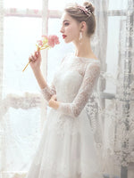 Long sleeve lace and tulle wedding dress