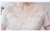 Short sleeve lace and tulle modest wedding dress
