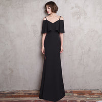 Long fitting dark black evening dress slit on the side 